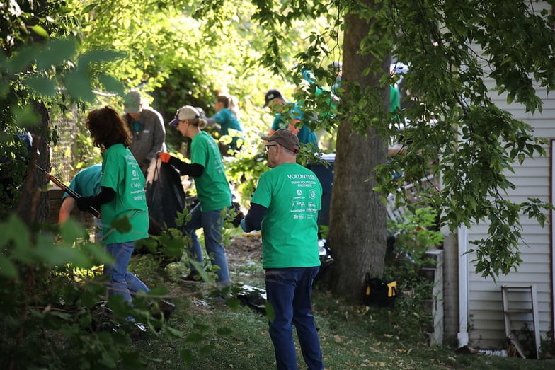Day of Action volunteers helping out with yard work.